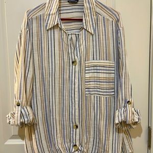 Unique Spectrum button up multi color shirt. 100% Cotton.